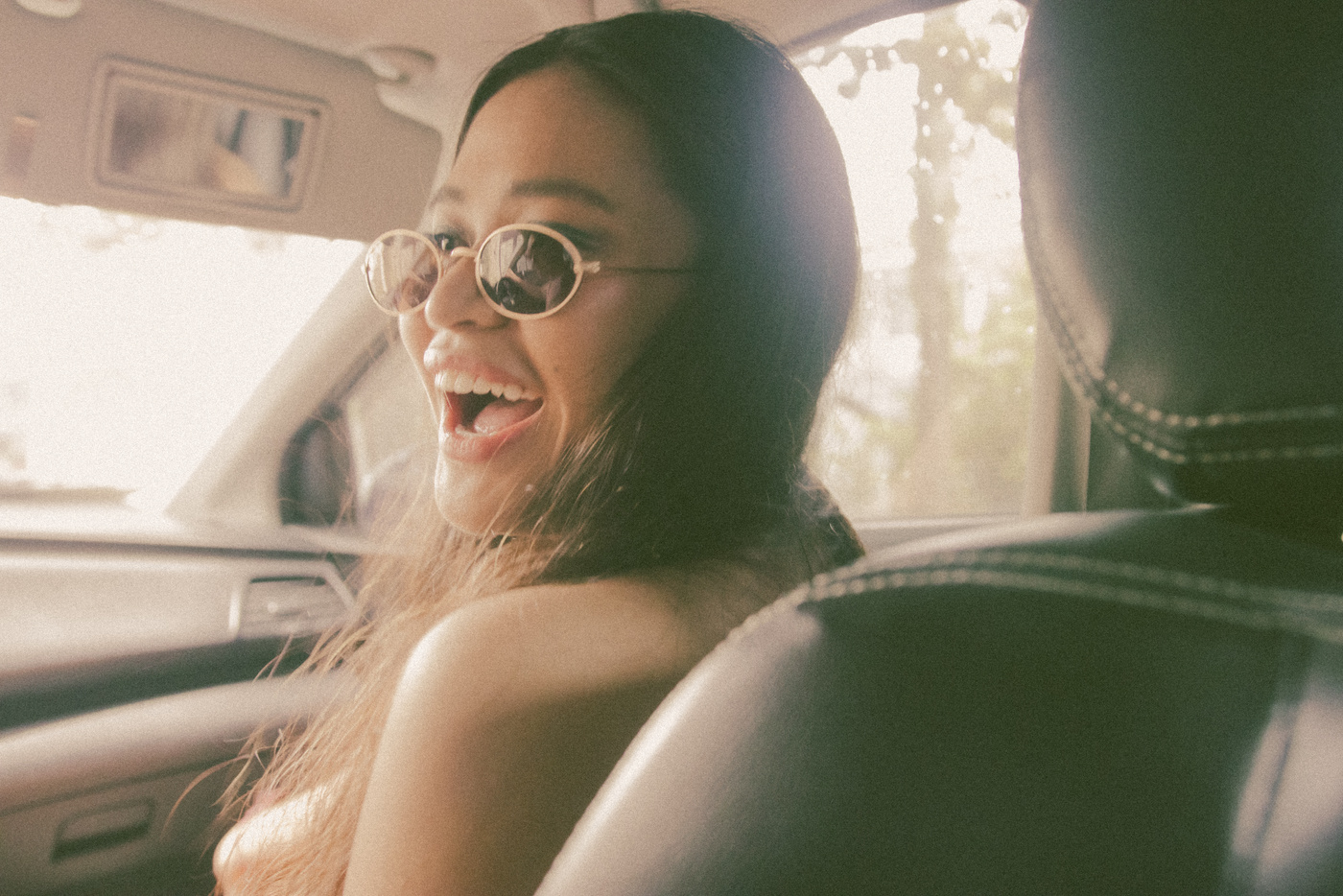 Cheerful Woman Sitting on Front Passenger Seat